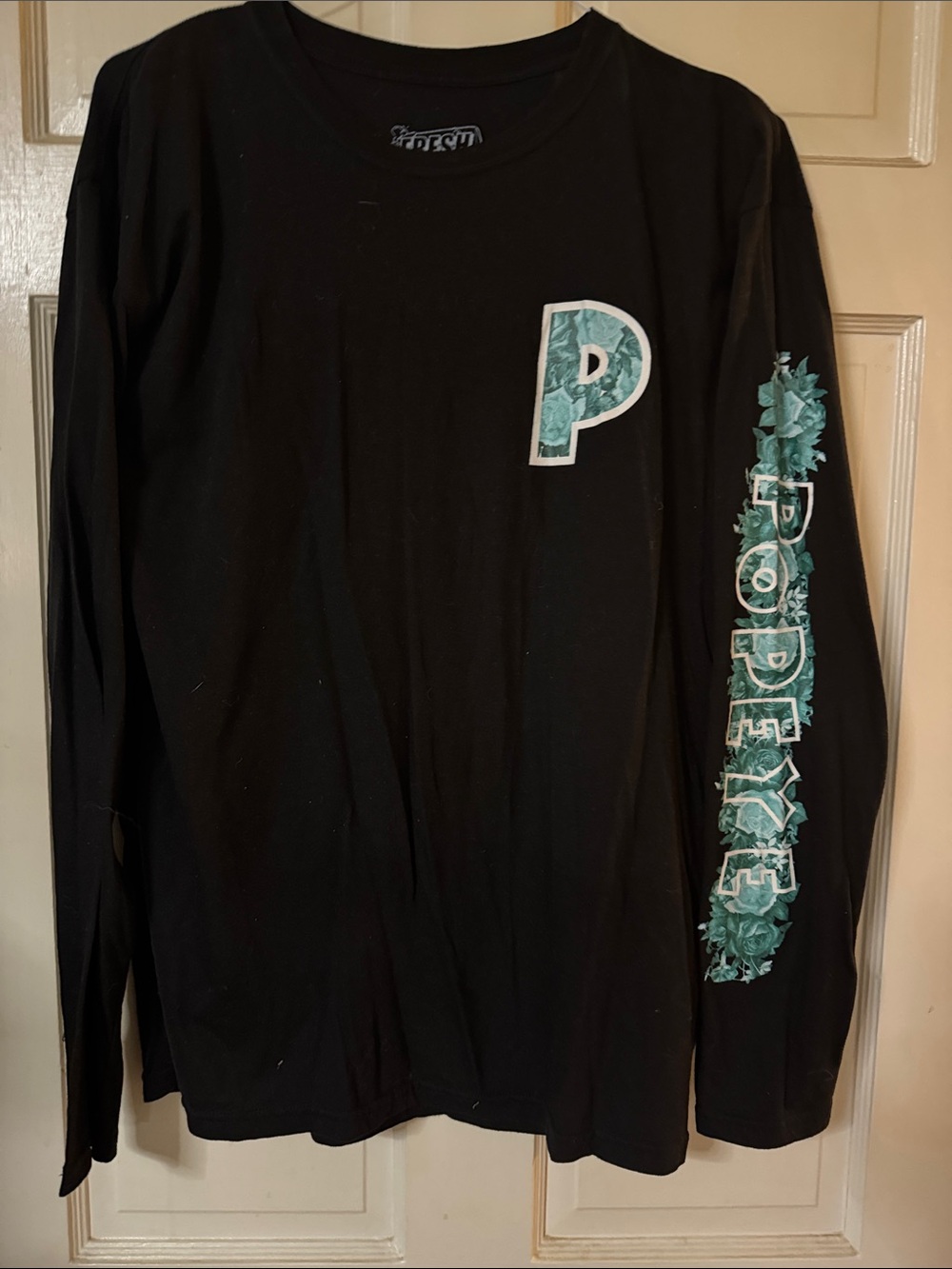 Men's Black Crewneck Sweater with Teal Floral 'P' and Sleeve Graphic